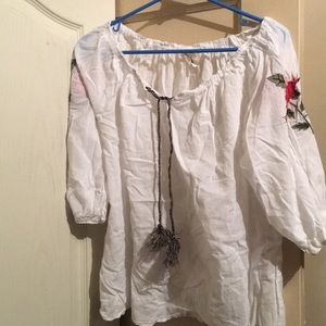 White blouse with floral embroidery on the sleeves